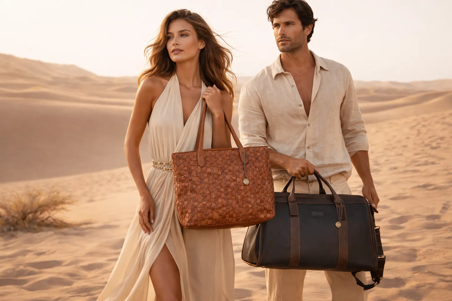 Man and woman walking in a desert with handbags